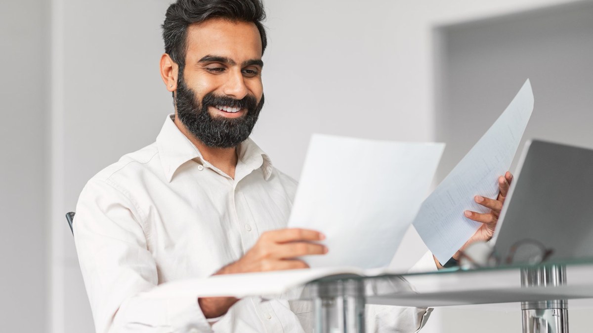 Bangladeshi student reviewing apostilled academic certificates and transcripts before submitting a student visa application