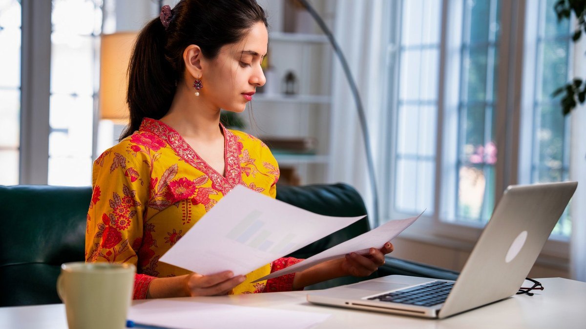 Bangladeshi student organising university application documents for a Chinese Government Scholarship application