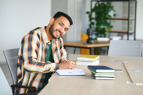 Bangladeshi student preparing university and residence permit documents for studying in Latvia