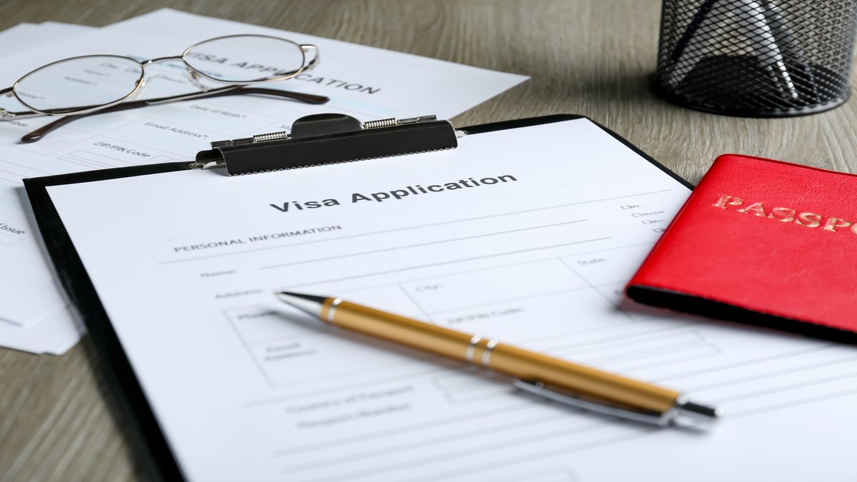 Bangladeshi student organising university admission documents and passport for a Philippines 9(f) student visa application
