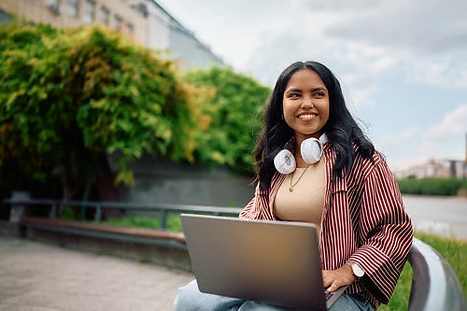 Bangladeshi student researching Slovakia student visa requirements on a laptop on a university campus