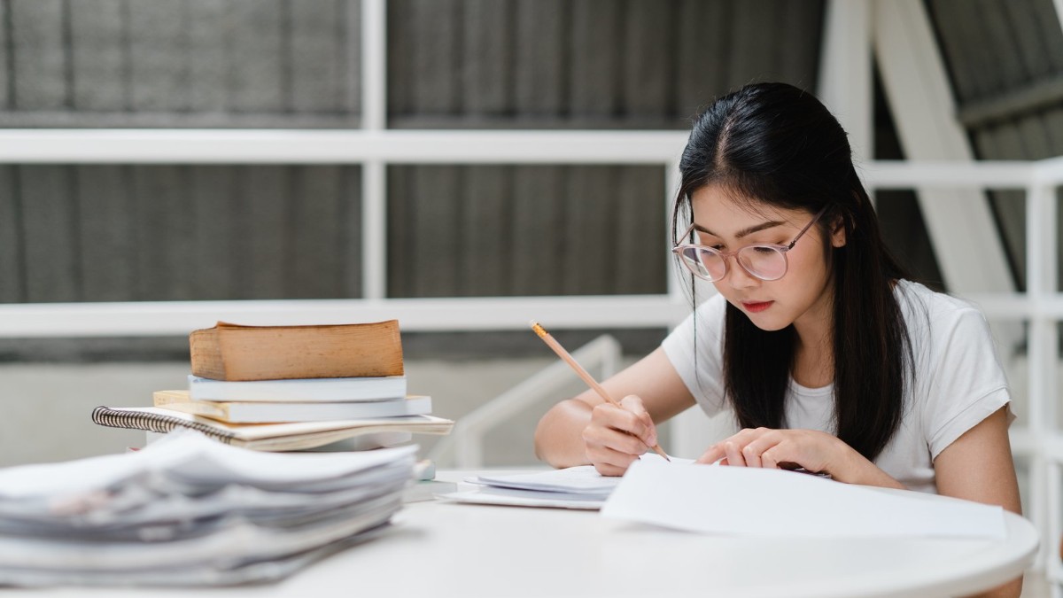 Student preparing South Korea D-2 student visa documents and university admission papers