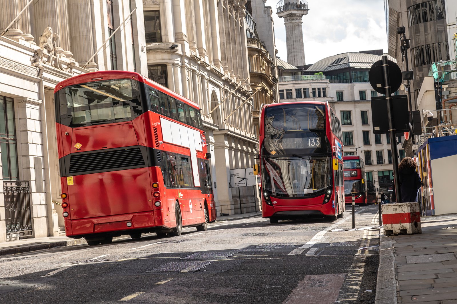 Red double-decker buses on a London street — UK cost of living for students 2027
